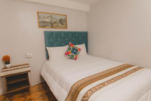 Postel nebo postele na pokoji v ubytování Lucios Cusco