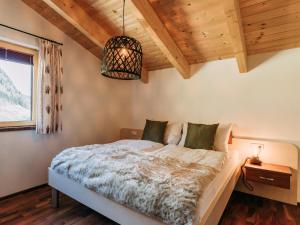 Łóżko lub łóżka w pokoju w obiekcie Bernkogel Penthouse