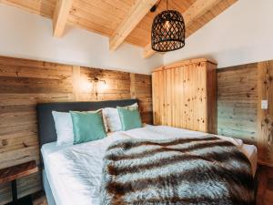 Łóżko lub łóżka w pokoju w obiekcie Bernkogel Penthouse