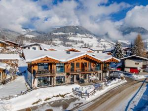 a log home in the mountains in the snow at Luxury Tauern Suite Walchen-Kaprun 3 in Piesendorf