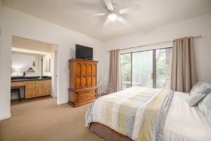 a bedroom with a bed and a dresser and a window at CW C109 River Bend in New Braunfels +42 photos