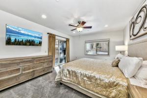 a bedroom with a bed and a ceiling fan at Tahoe Woods 501 - Location Spacious Walk to Beach in South Lake Tahoe