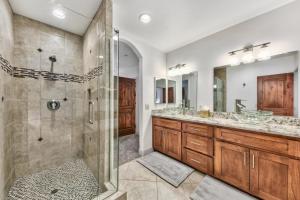 a bathroom with two sinks and a shower at Tahoe Woods 501 - Location Spacious Walk to Beach in South Lake Tahoe +26 photos
