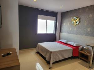 Hotel Condina Pereira客房内的一张或多张床位