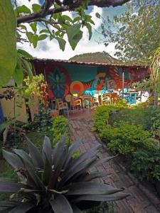 a patio with a painting on the side of a house at Ulucaho Hostel in Bogotá