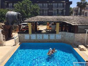 a group of people in a swimming pool at a hotel at Noo 15 in Side