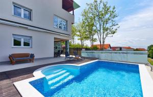 a swimming pool in the backyard of a house at Pet Friendly Home In Zagreb in Dolje