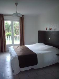 Postel nebo postele na pokoji v ubytování L'Orée des Châteaux