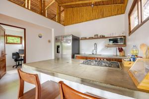 a kitchen with a large counter top in a room at Villa Fruta del Cielo in Uvita