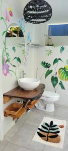 a bathroom with a sink and a toilet at Mecca in Puerto Viejo