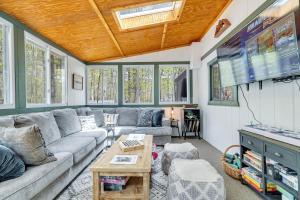 a living room with a couch and a flat screen tv at Close to Locust Lake:Beach:Fire Pit:Kalahari in Locust Lakes Village