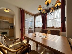 a kitchen and dining room with a table and chairs at Landhaus Eibele in Oberstaufen
