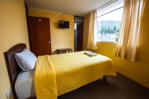 Łóżko lub łóżka w pokoju w obiekcie La Posada de Lucero