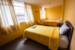 Łóżko lub łóżka w pokoju w obiekcie La Posada de Lucero