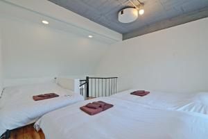 Tempat tidur dalam kamar di V Close to Olympic Stadium Sendagaya Roof top Terrace