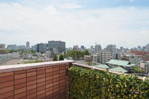 a view of the city from the roof of a building at V Close to Olympic Stadium Sendagaya Roof top Terrace in Tokyo