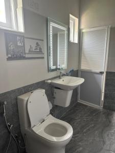 Koupelna v ubytování Kande Home + 7 fotografií