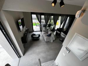 an overhead view of a living room with a couch at Villa Sunset Yerakini in Poligiros