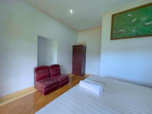 Postel nebo postele na pokoji v ubytování Mulia Garden Bungalows - Monthly Rate Available