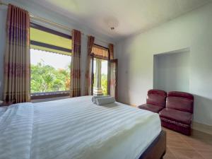Postel nebo postele na pokoji v ubytování Mulia Garden Bungalows - Monthly Rate Available