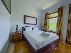 Postel nebo postele na pokoji v ubytování Mulia Garden Bungalows - Monthly Rate Available