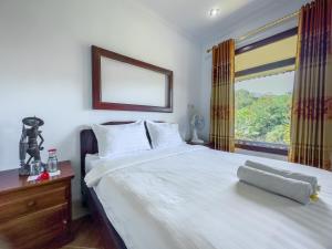 Postel nebo postele na pokoji v ubytování Mulia Garden Bungalows - Monthly Rate Available