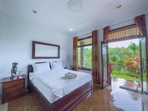Postel nebo postele na pokoji v ubytování Mulia Garden Bungalows - Monthly Rate Available