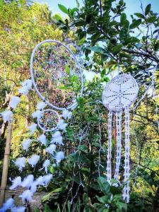 a garden with some decorations in a tree at Avong Nen Kitma in Baguio
