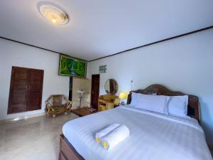 Postel nebo postele na pokoji v ubytování Mulia Garden Bungalows - Monthly Rate Available