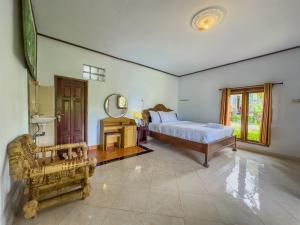 Postel nebo postele na pokoji v ubytování Mulia Garden Bungalows - Monthly Rate Available