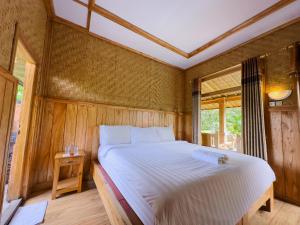 Postel nebo postele na pokoji v ubytování Mulia Garden Bungalows - Monthly Rate Available