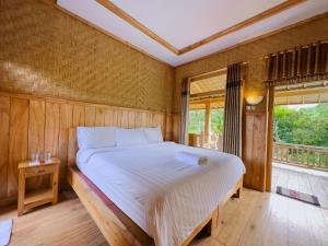 Postel nebo postele na pokoji v ubytování Mulia Garden Bungalows - Monthly Rate Available