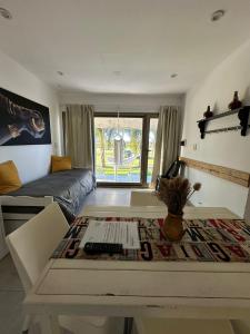 a living room with a table and a couch at Chajari Suites in Chajarí