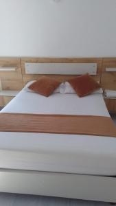 Säng eller sängar i ett rum på Hotel Gutier Rionegro