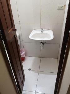 a bathroom with a sink and a toilet at La Casa Del Viajero in Arequipa