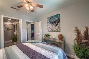 a bedroom with a bed and a ceiling fan at DT 534 Castle Shadow Cottage in New Braunfels