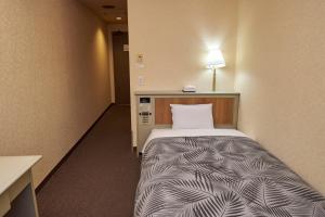 Postel nebo postele na pokoji v ubytování Hotel Machida Villa