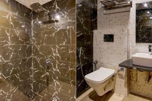 a bathroom with a toilet and a sink at Super Townhouse 1363 Hotel Lindo Lugar in Alwar