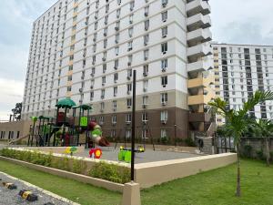 a playground in front of a large building at Lapu-Lapu City Condo in Lapu Lapu City