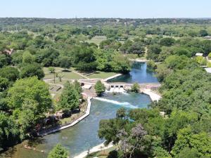 an aerial view of a river with a waterfall at CW B202 Camp Warnecke B202 in New Braunfels