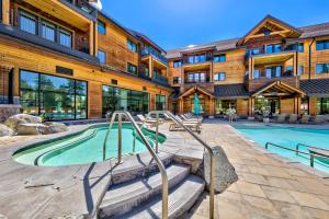 a building with a swimming pool in front of a building at Zalanta 222 - Sun Fun and Mountain Runs in Stateline