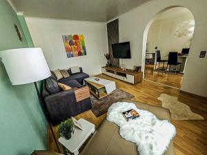 a living room with a couch and a table at Apartment Sophia in Hamm