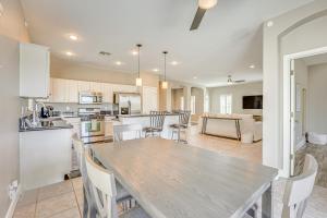 a kitchen and dining room with a table and chairs at Coldwater Golf Course Getaway in Avondale! in Avondale