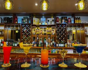 a bar with several glasses on a counter at Banaue Grandview Hotel in Banaue