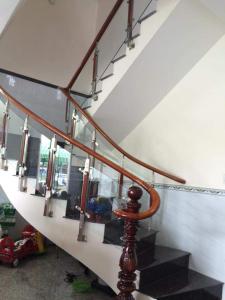 a stairway with a set of stairs with a glass railing at Mỹ Tươi Hotel PQ - by BAY LUXURY in Phu Quoc