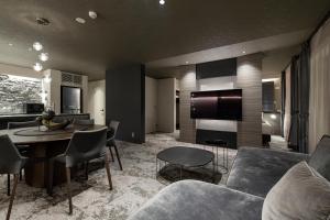 a living room with a couch and a table at HOTEL MASTAY jingumichi in Kyoto +154 photos