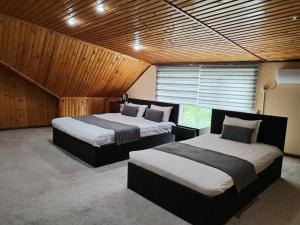 Katil atau katil-katil dalam bilik di GUEST HOUSE "Rohat Lux"