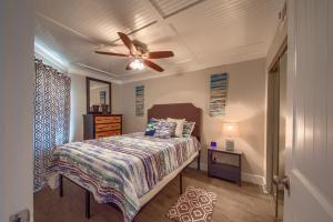 a bedroom with a bed and a ceiling fan at River Hippie RRC A302 in New Braunfels +24 photos