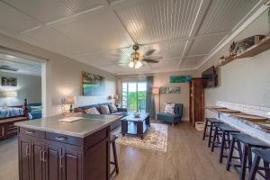 a kitchen and living room with a couch and a table at River Hippie RRC A302 in New Braunfels