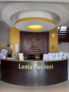 a lobby with a sign that reads lanta for rest at Lanta for Rest Boutique in Ko Lanta